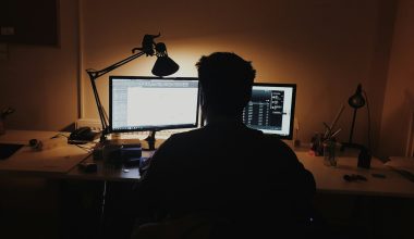 man using computer inside room